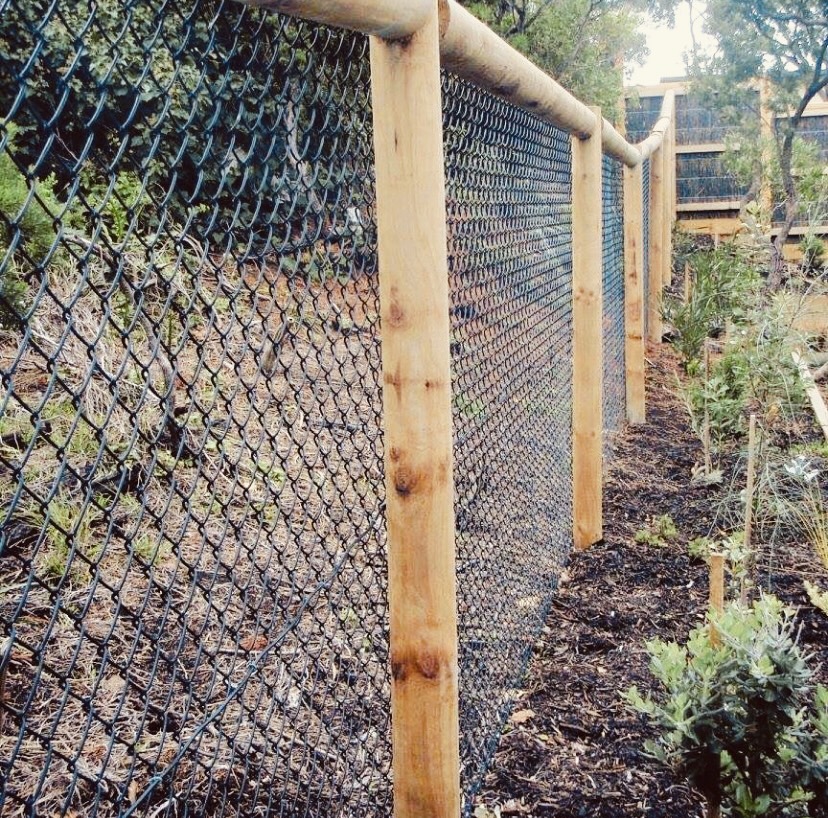 Black Chainmesh on Round Pine Poles with Top Rail